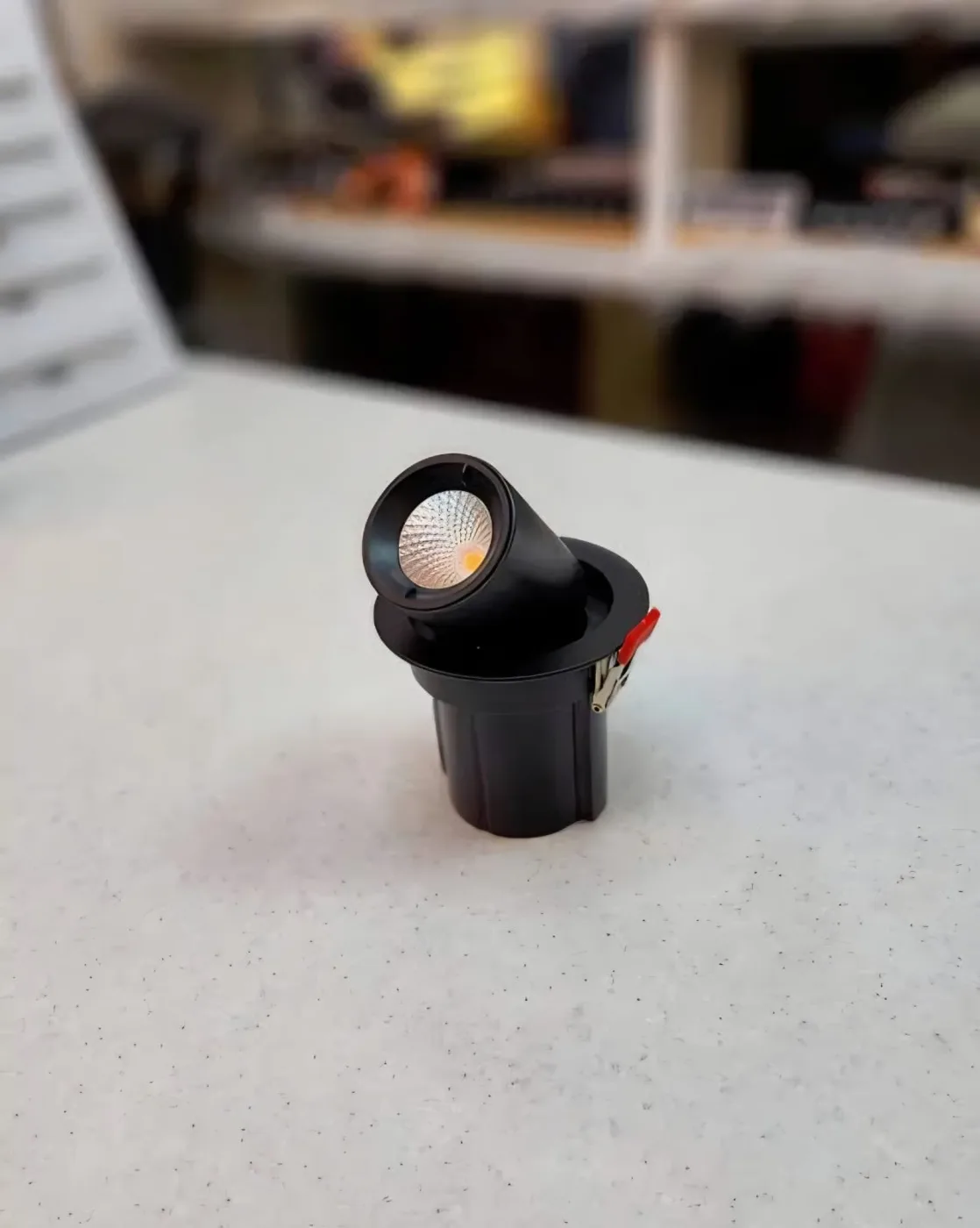Small adjustable grille spotlight module